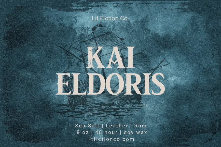 Book cover with a pirate ship illustration in the background, titled 'Kai Eldoris' by Lit Fiction Co., featuring sea salt, leather, rum, 8 oz soy wax, 40 hours burnt, and the website litfictionco.com.