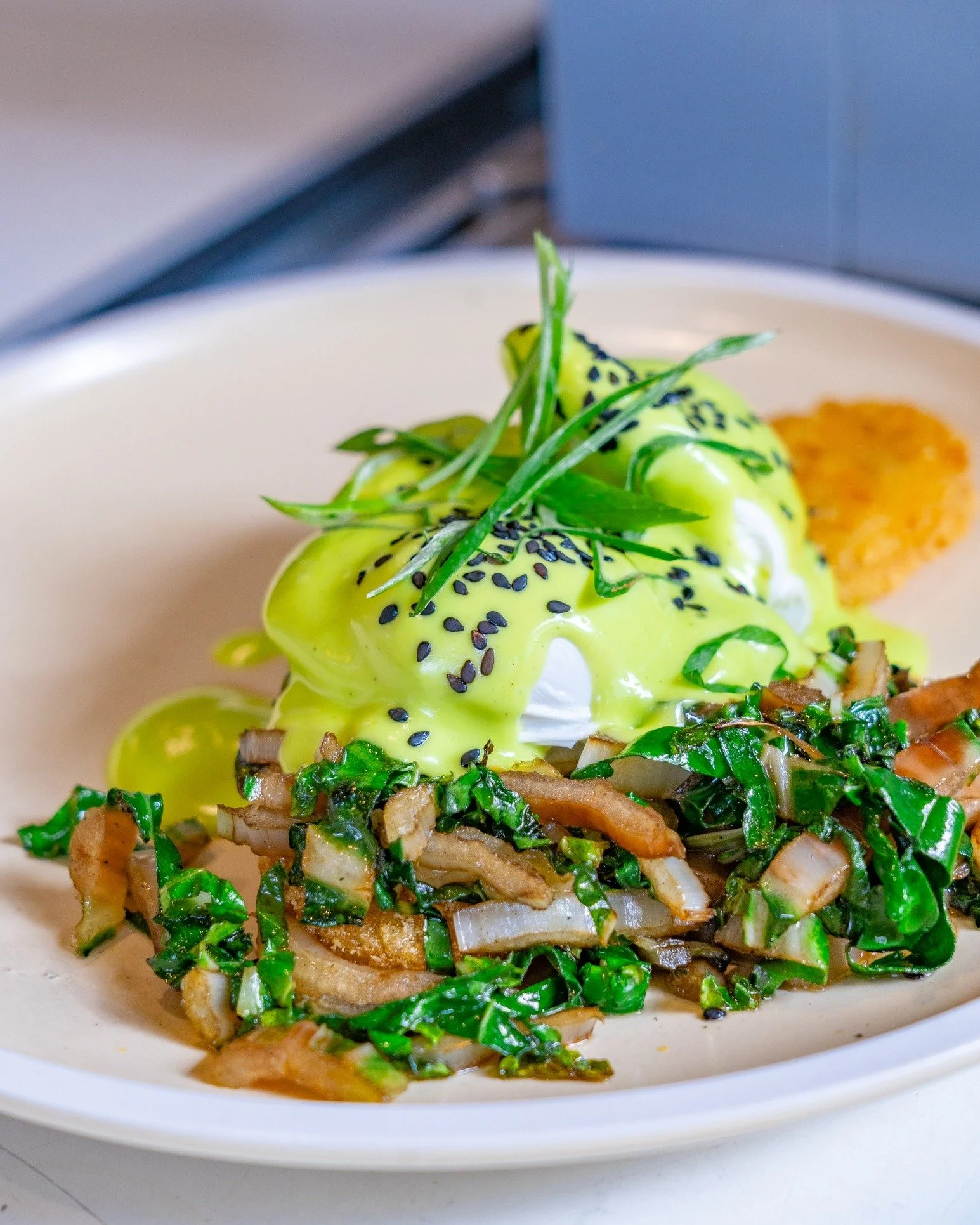 GREEN EGGS! GREEN EGGS! 💚🥚⁣
⁣
Two eggs on two hash browns,⁣
with greens going round and round.⁣
Then comes the hollandaise -⁣
wasabi with a little KA-POW! 🌿⁣
⁣
Creamy, crispy, green and bright,⁣
a breakfast that feels just right.⁣
⁣
Would you eat 