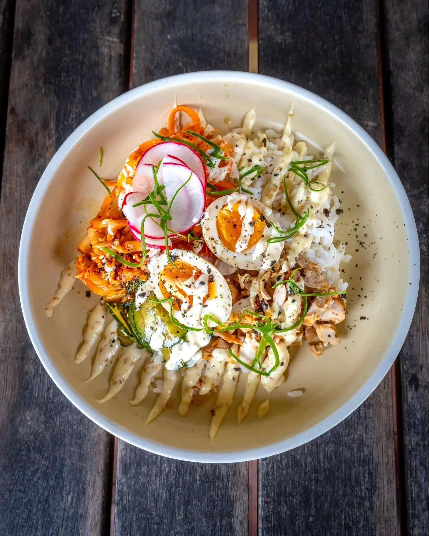 BOWL GOALS. 🔥🔥⁣
⁣
Our Sushi Bowl brings together seasoned rice, spicy kimchi, crunchy cucumber salad, pickles, a soy egg and our seriously delicious Gochujang chicken, finished with roasted sesame.⁣
⁣
You've got the heat, the crunch, the tang and a
