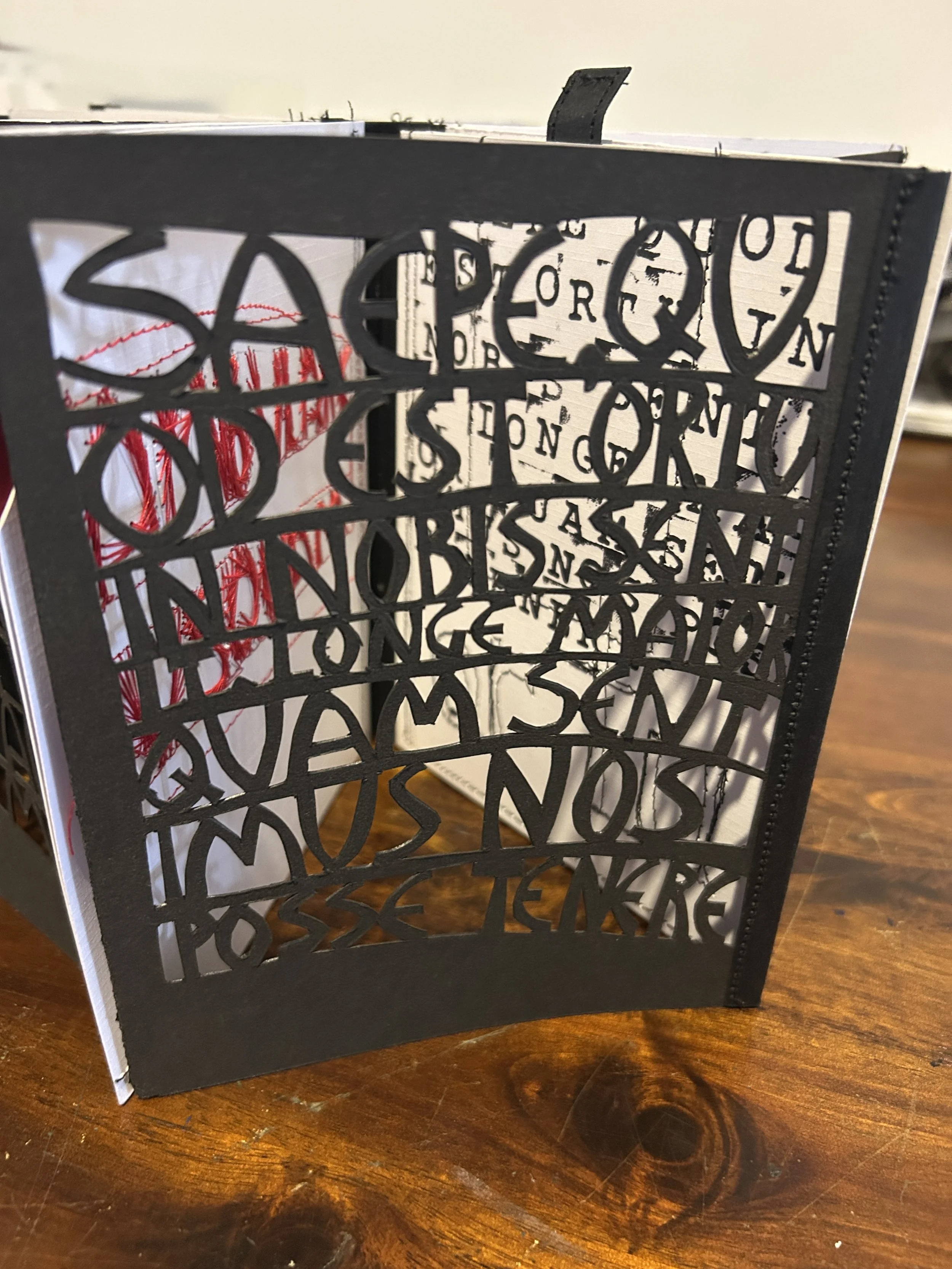 Latin words for a text page - carefully cut out by hand.