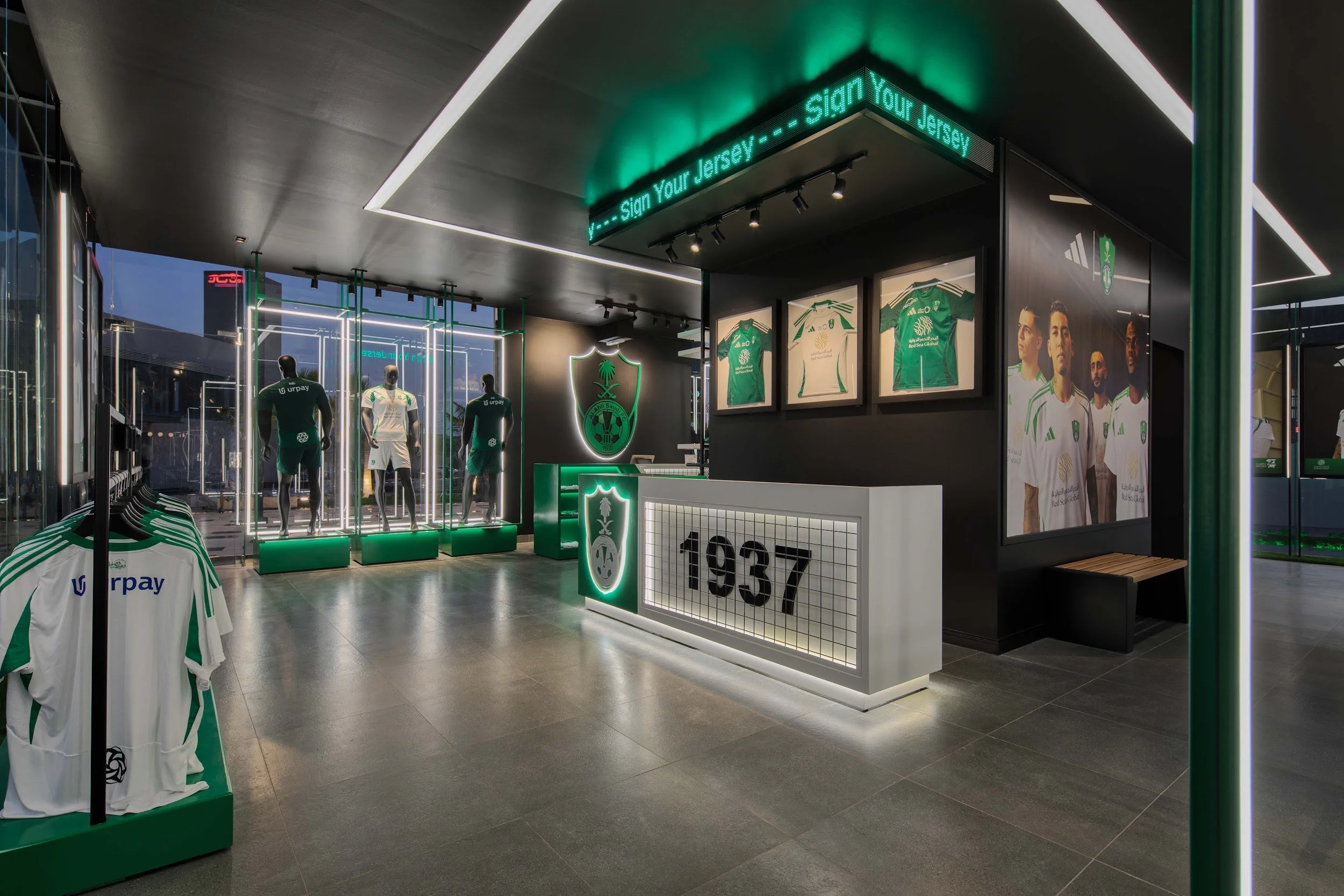Al Ahli × Adidas store, inside: kit wall, mannequins and the counter