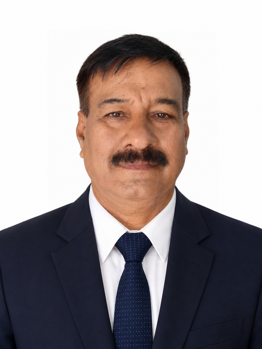 A middle-aged man with a mustache wearing a black suit, white shirt, and a dark blue tie, posing against a plain white background.