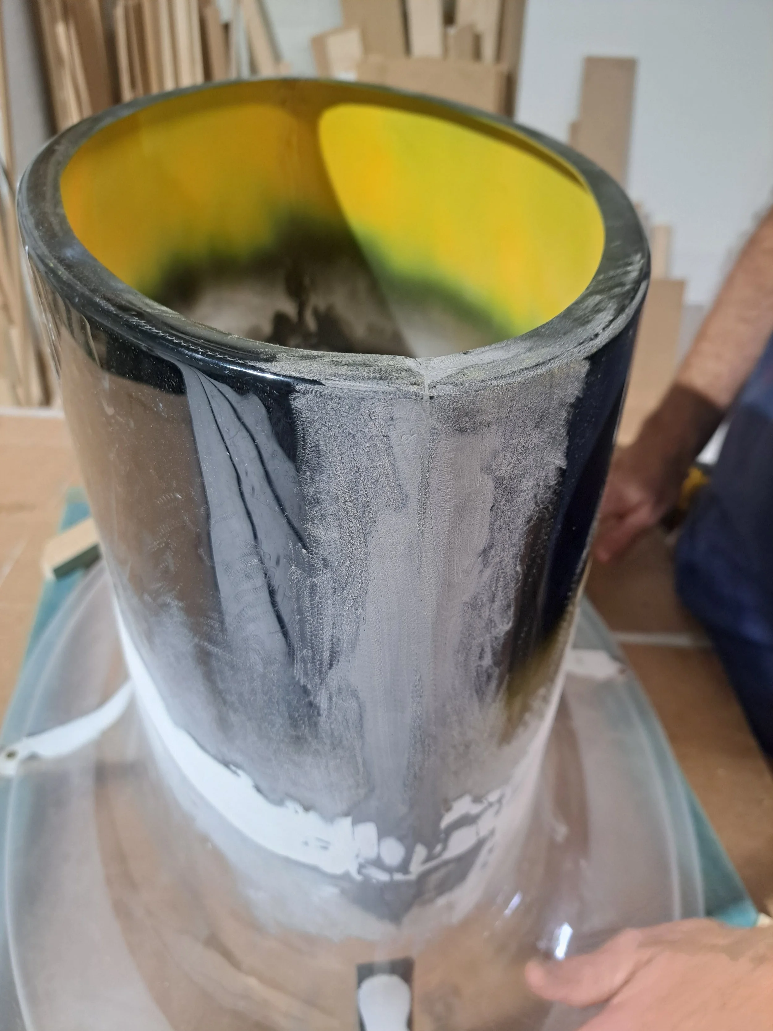 Close-up view Custom built props, spray booth for cylindrical structures and a large white curved structure mounted moulded bases Custom high end luxury retail brands window dressing, installation. HR Productions Sydney