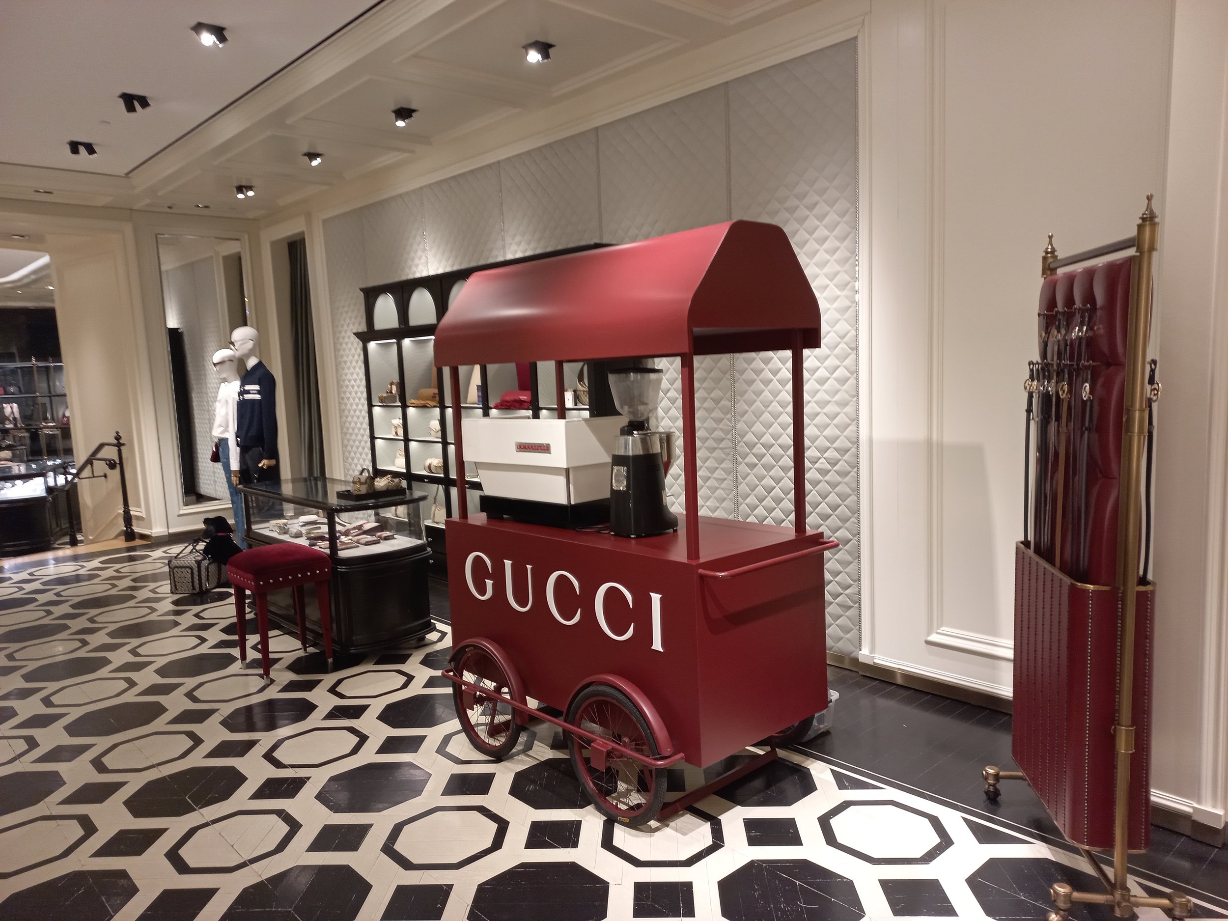 Custom Red coffee cart. HR Productions High end retail, luxury brands sydney produciton with custom props and installation