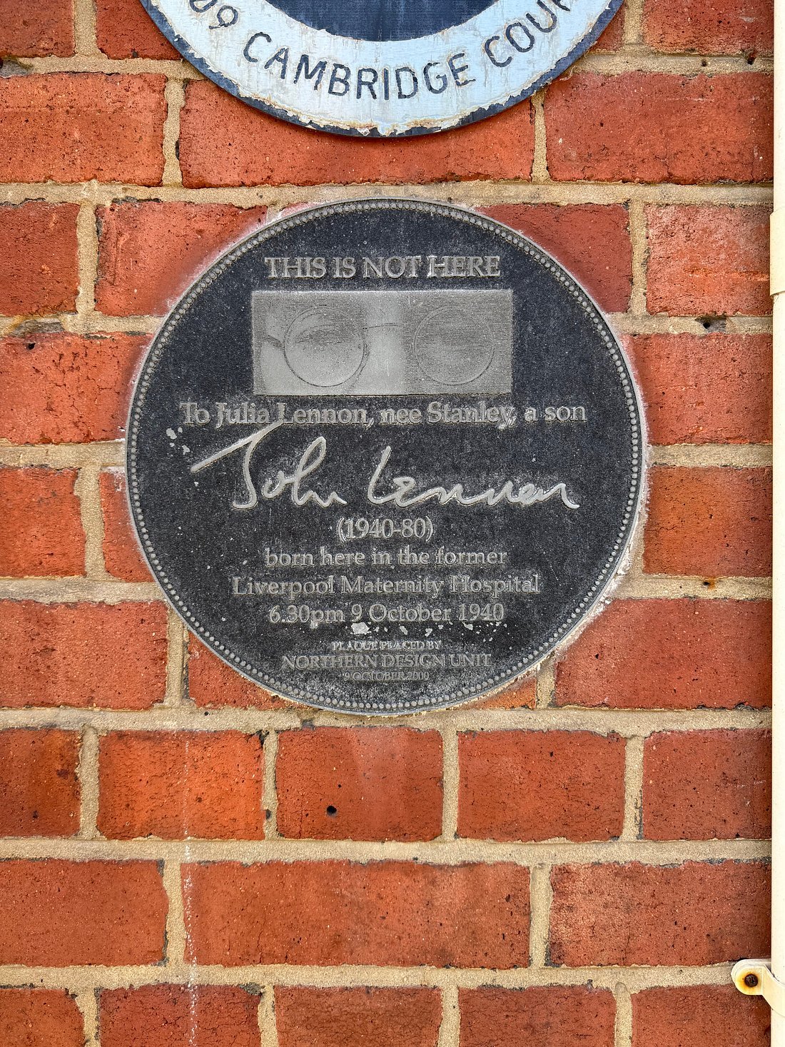 Memorial plaque on a Liverpool brick wall commemorating John Lennon’s birth at Liverpool Maternity Hospital on 9 October 1940