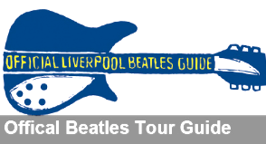 Guitar‑shaped Official Liverpool Beatles Guide mascot with printed text on its side