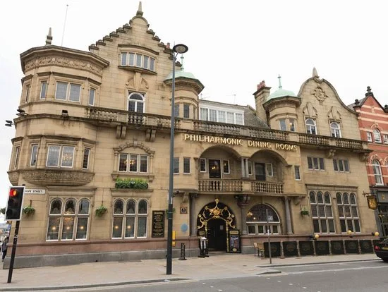 Historic multi‑storey Philharmonic Dining Rooms building in Liverpool with ornate architecture and large windows