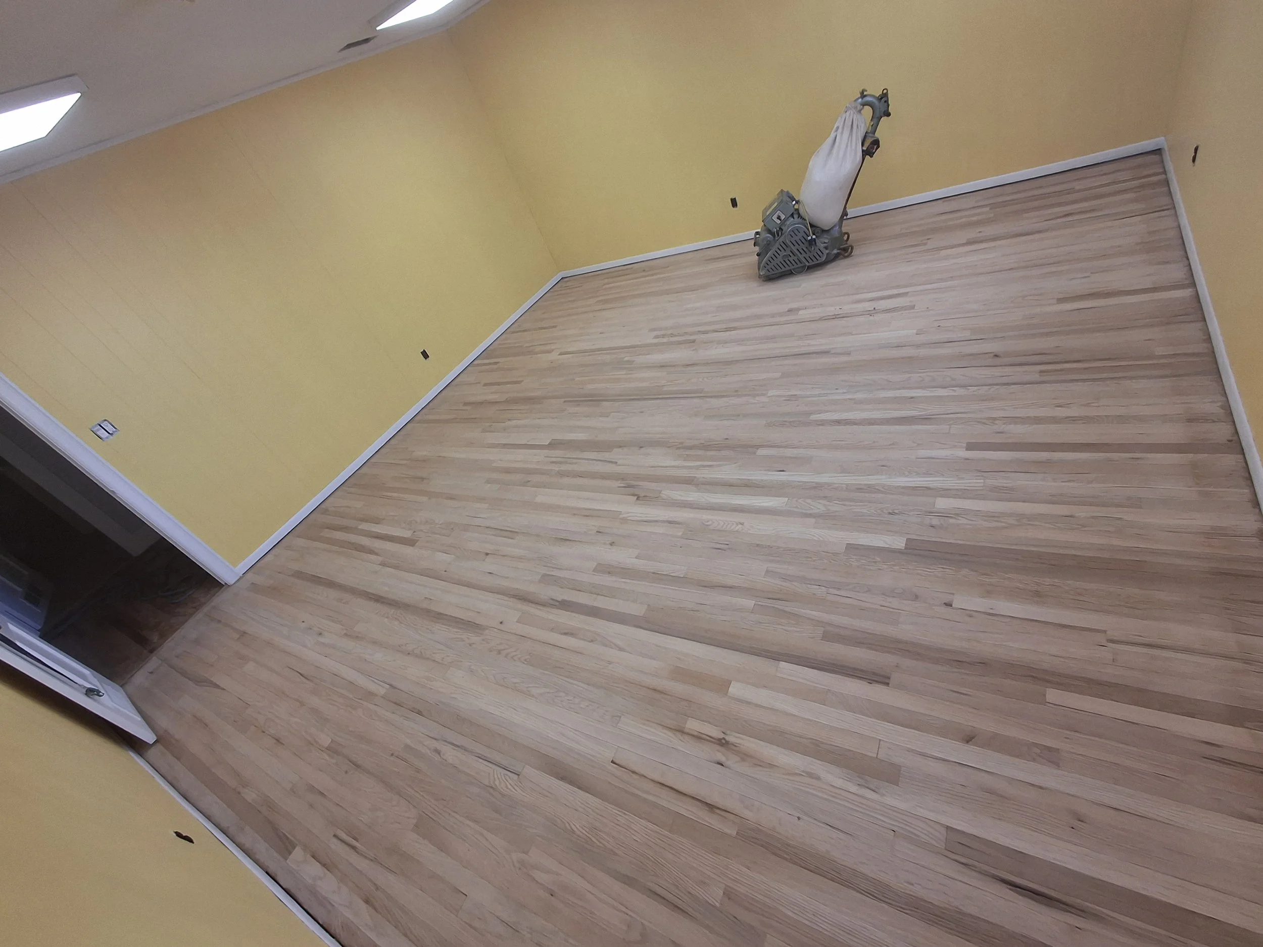 Residential flooring project completed by Floyd's Flooring & Stairs. Expert installation of hardwood flooring, luxury vinyl plank, engineered hardwood, stair renovations, floor repairs, and flooring remodels throughout the Piedmont and Triad, NC