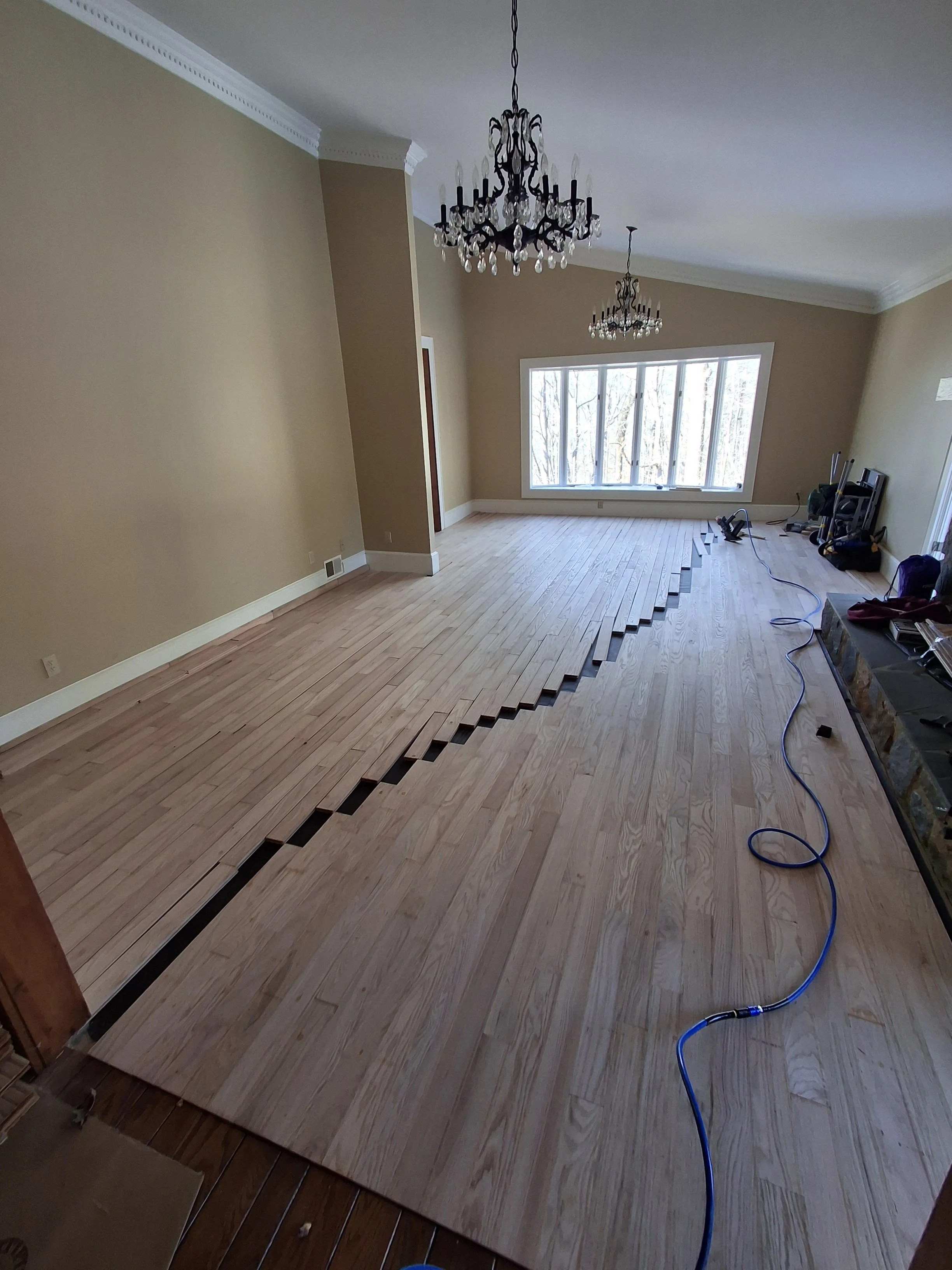 Professional flooring installation by Floyd's Flooring & Stairs featuring luxury vinyl plank (LVP), hardwood flooring, laminate flooring, engineered hardwood, stair refinishing, subfloor repair, and custom flooring services in Winston-Salem, NC