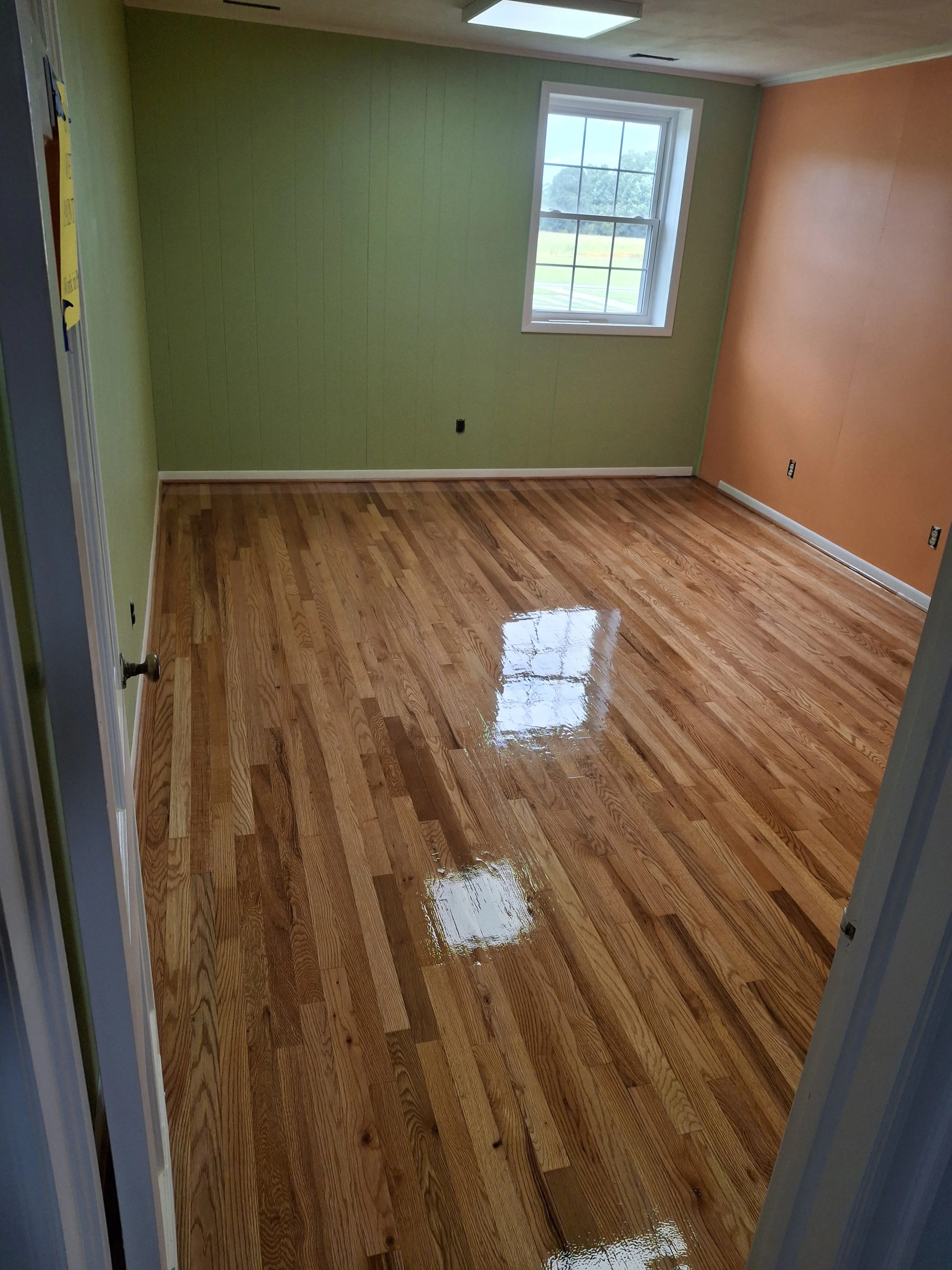 Residential flooring project completed by Floyd's Flooring & Stairs. Expert installation of hardwood flooring, luxury vinyl plank, engineered hardwood, stair renovations, floor repairs, and flooring remodels throughout the Piedmont and Triad, NC