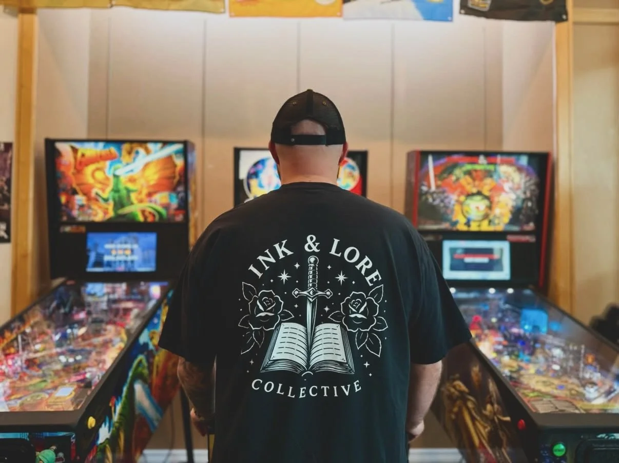 Can we all agree that seeing Ink &amp; Lore out in the wild will NEVER get old?! 👀🖤

Safe to say we&rsquo;re obsessed. If you&rsquo;ve got the merch, post it, tag us, and let us see where your stories are leaving their mark. ⚔️📖

📸 cred: @raising