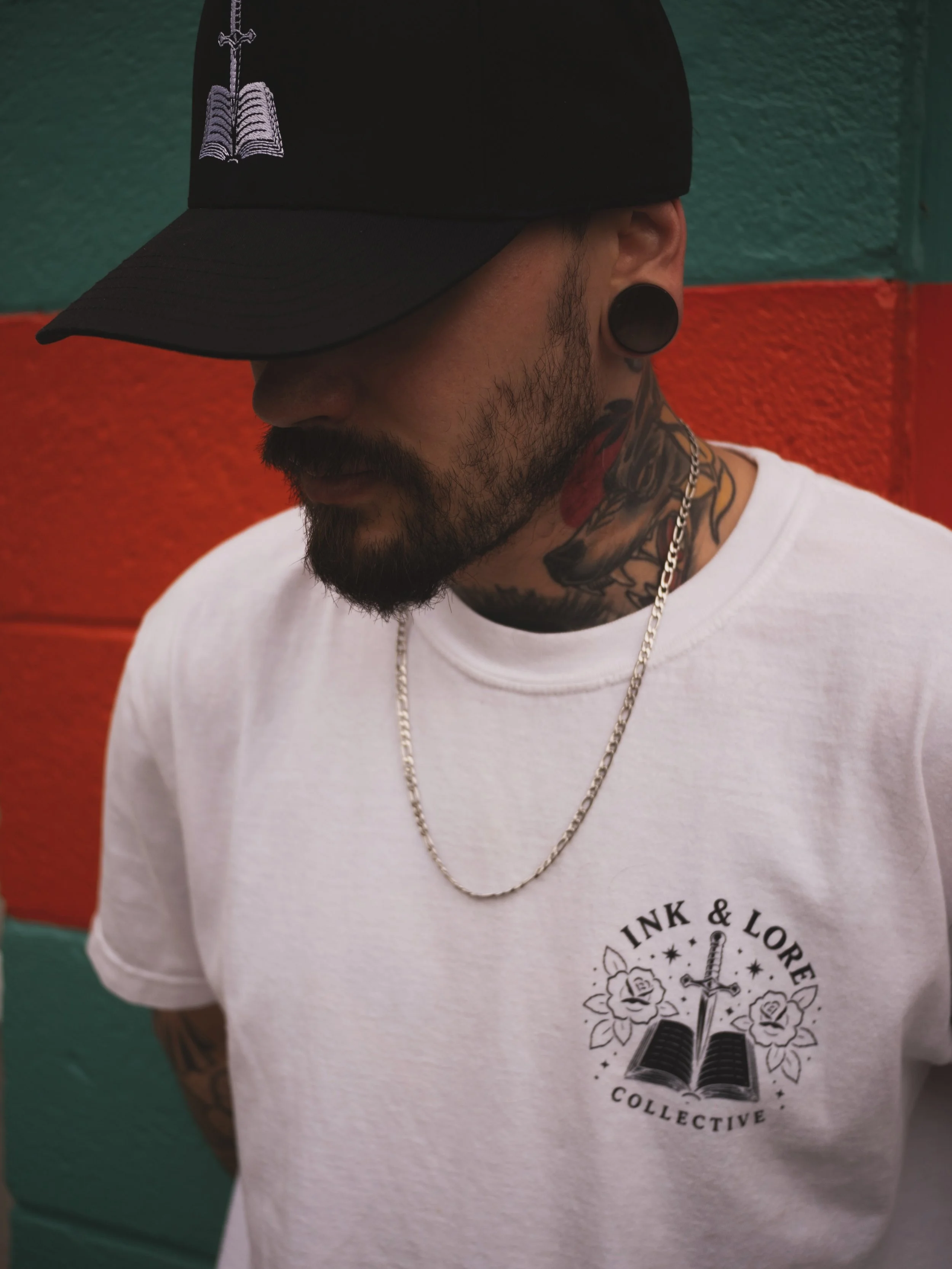 We were going to keep this under our hats&hellip; but we&rsquo;re terrible at secrets. 👀🖤

Embroidered book-and-dagger details, Ink &amp; Lore on the side, and a hat drop is HERE. Safe to say, you&rsquo;re going to want this one. ⚔️📖

Who needs it