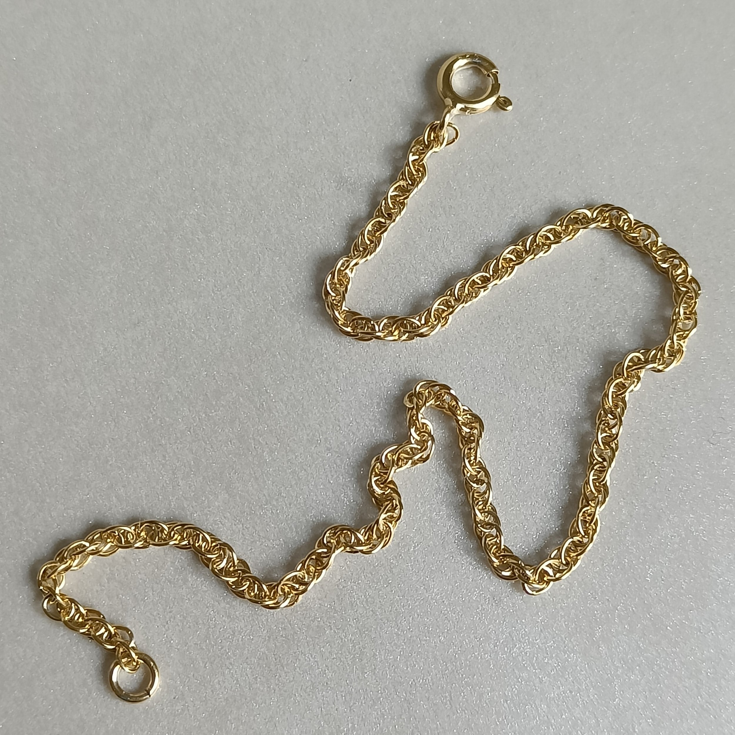 Zilveren vergulde armband, koningsketting met veerringslot.