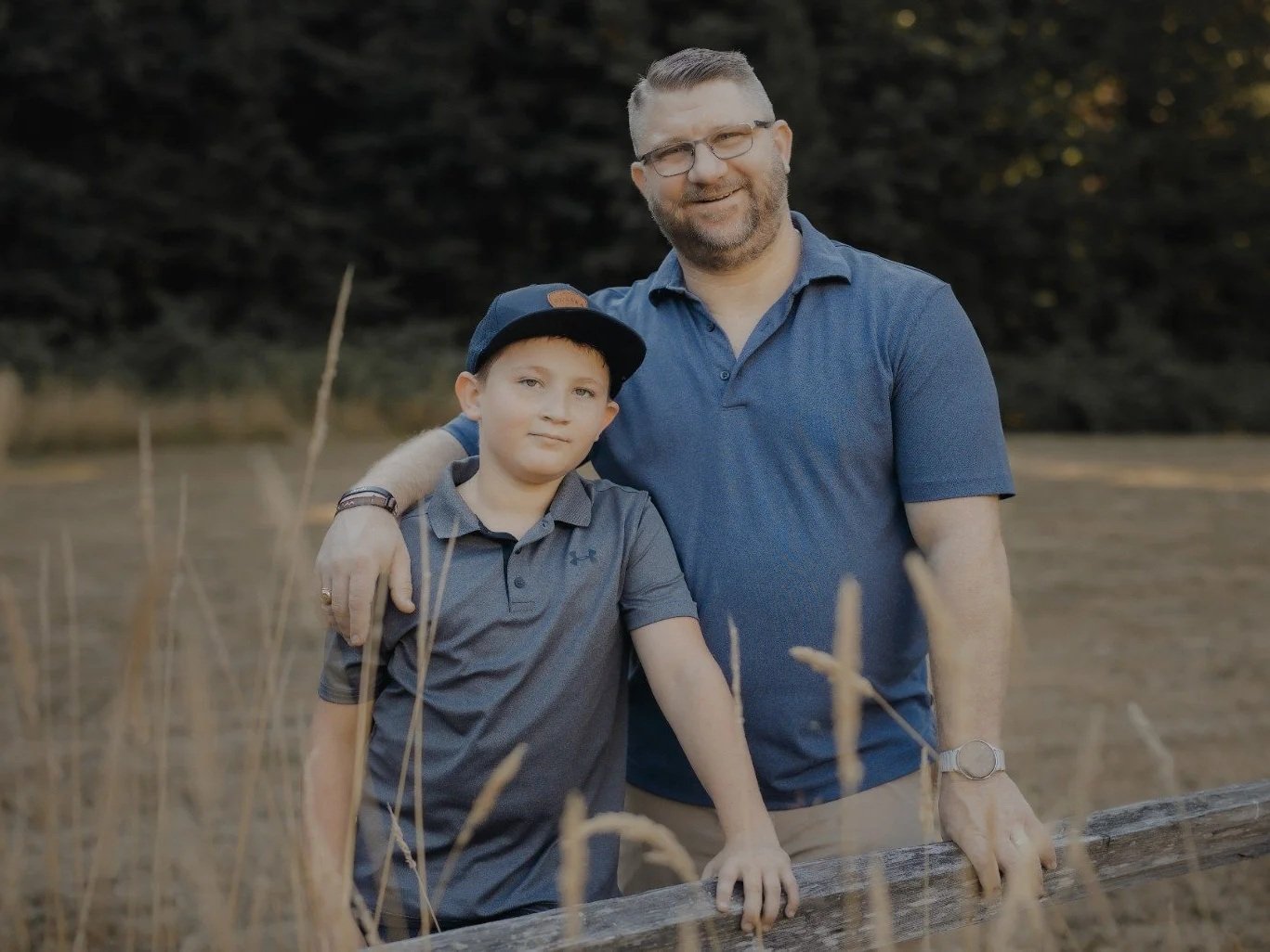 Brian Brozovic with his son outdoors, reflecting the family and caregiving experiences that shape his advocacy.