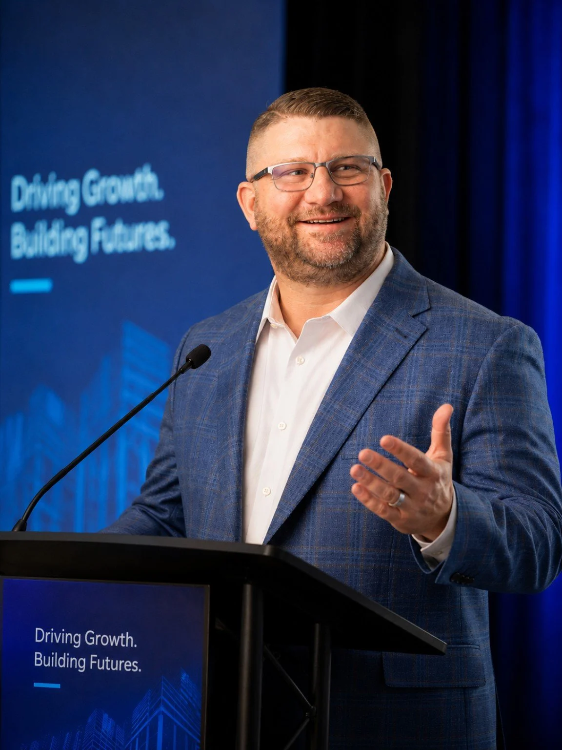 Brian Brozovic speaking at a podium during a professional conference.