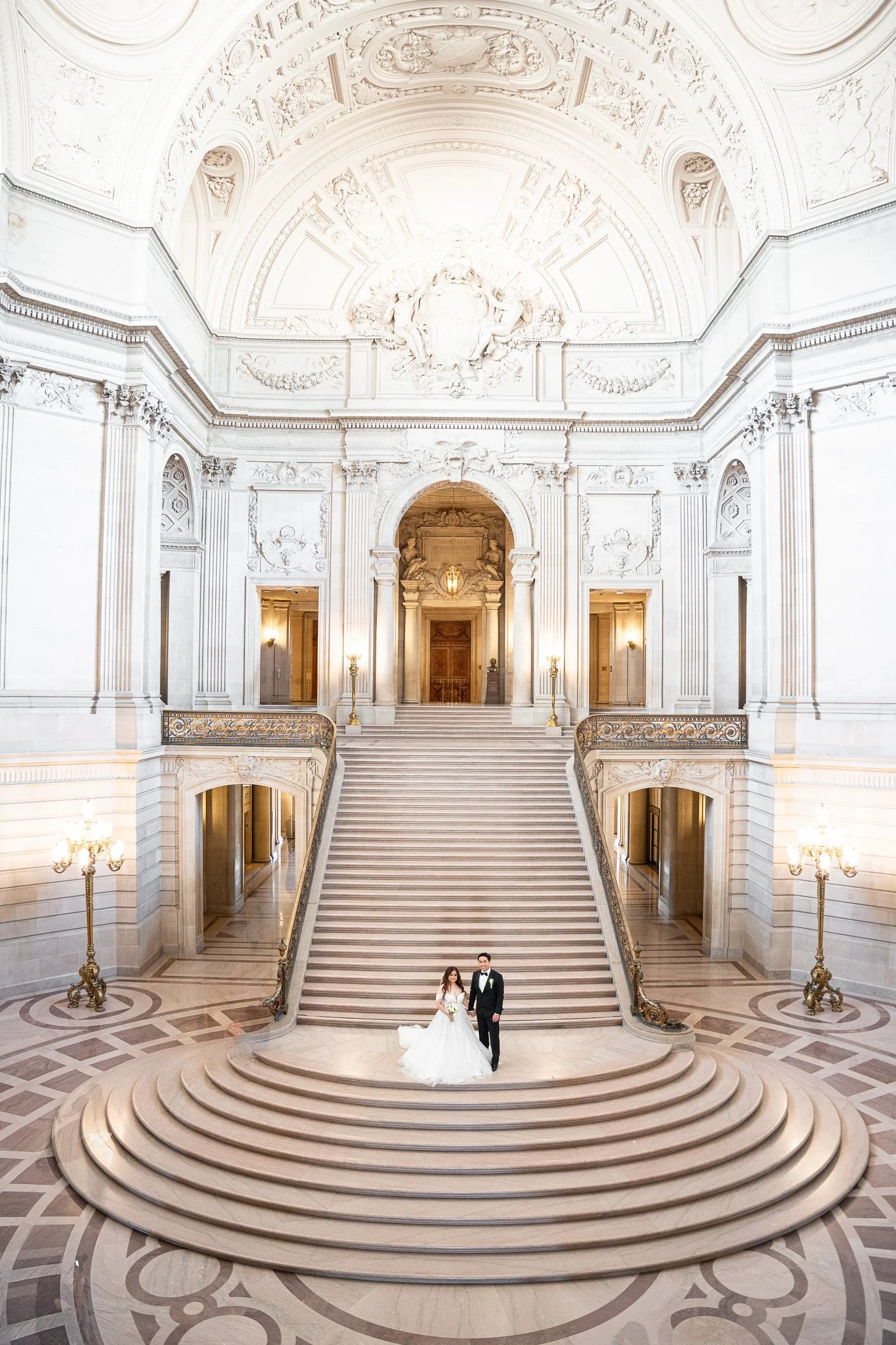 SF City Hall wedding photographer — bride and groom on the Grand Staircase