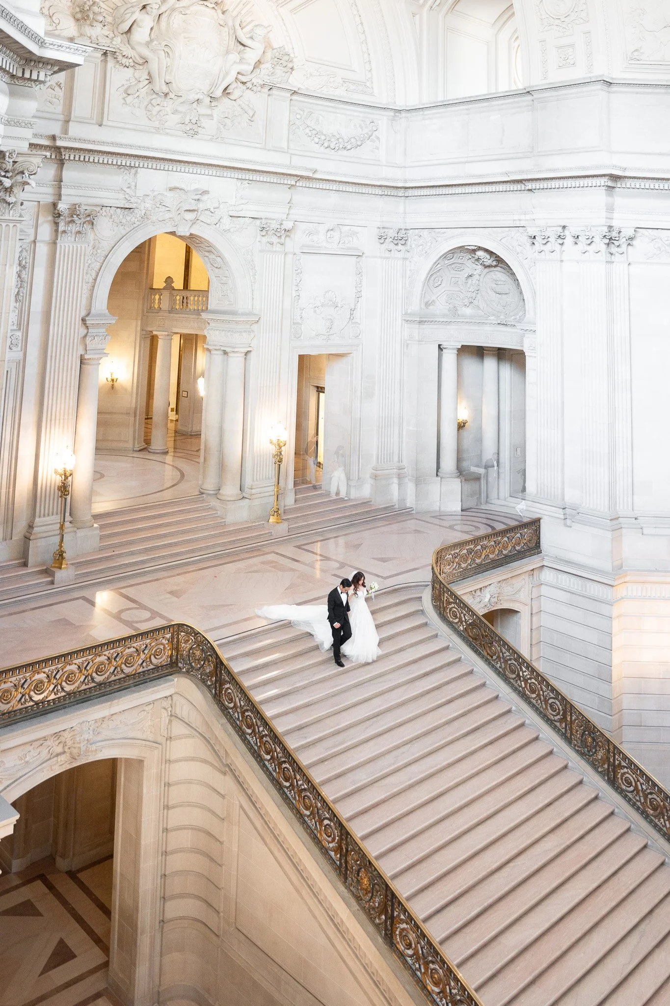 SF City Hall wedding photographer — bride and groom on the Grand Staircase