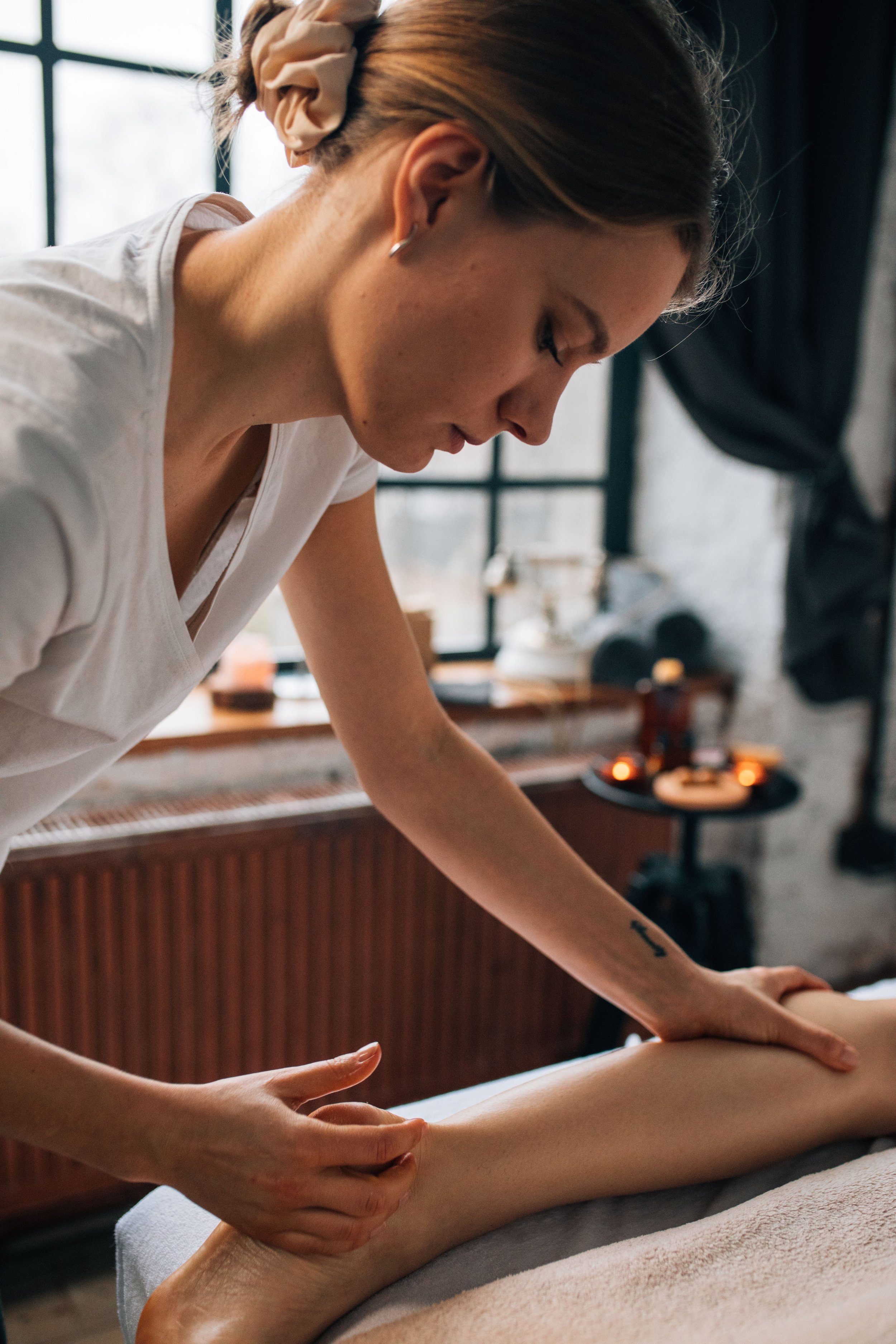 A woman getting a massage in a spa or massage therapy room.
