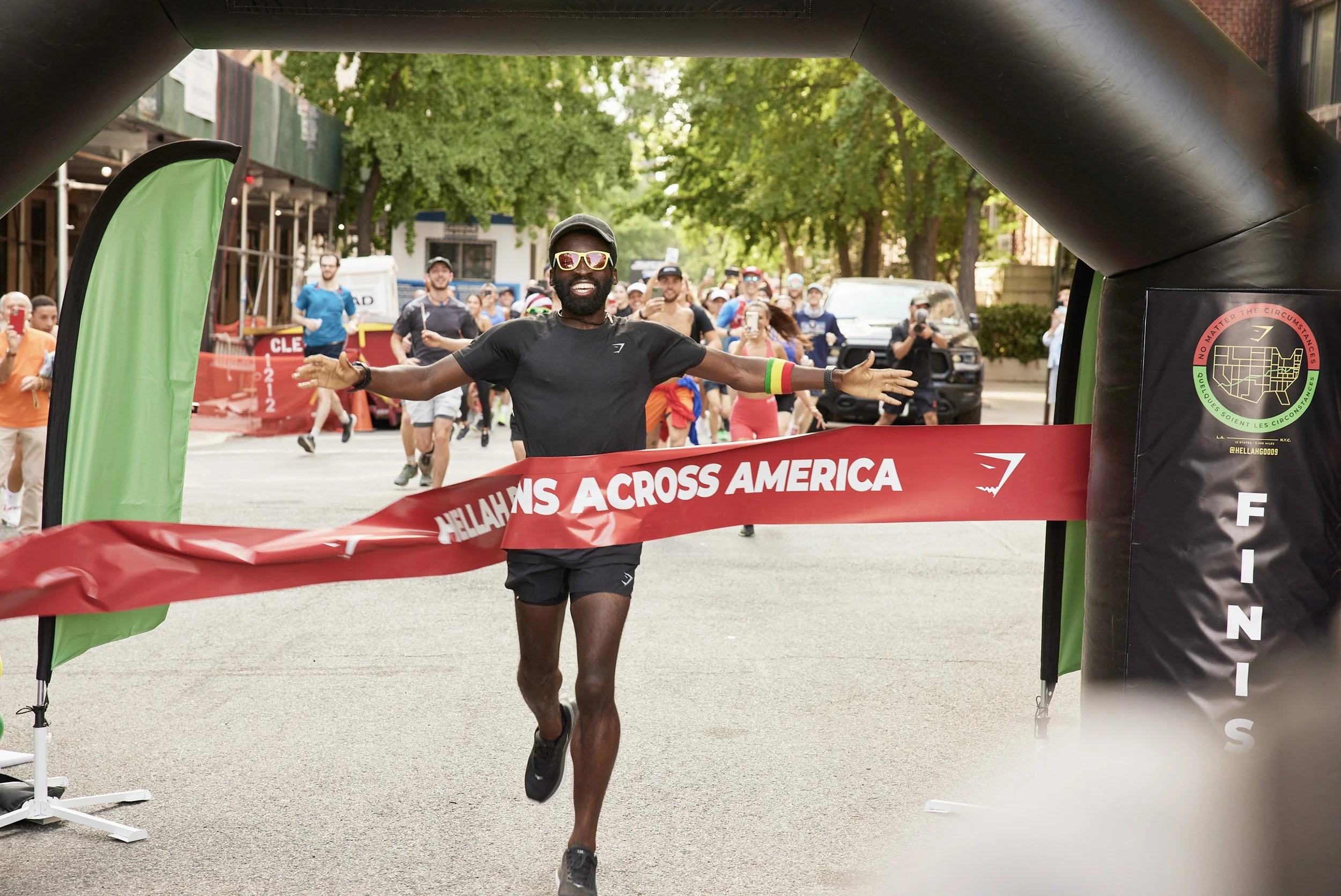 Hellah Sidibe crossing the finish line in New York City after completing his run across America.”
