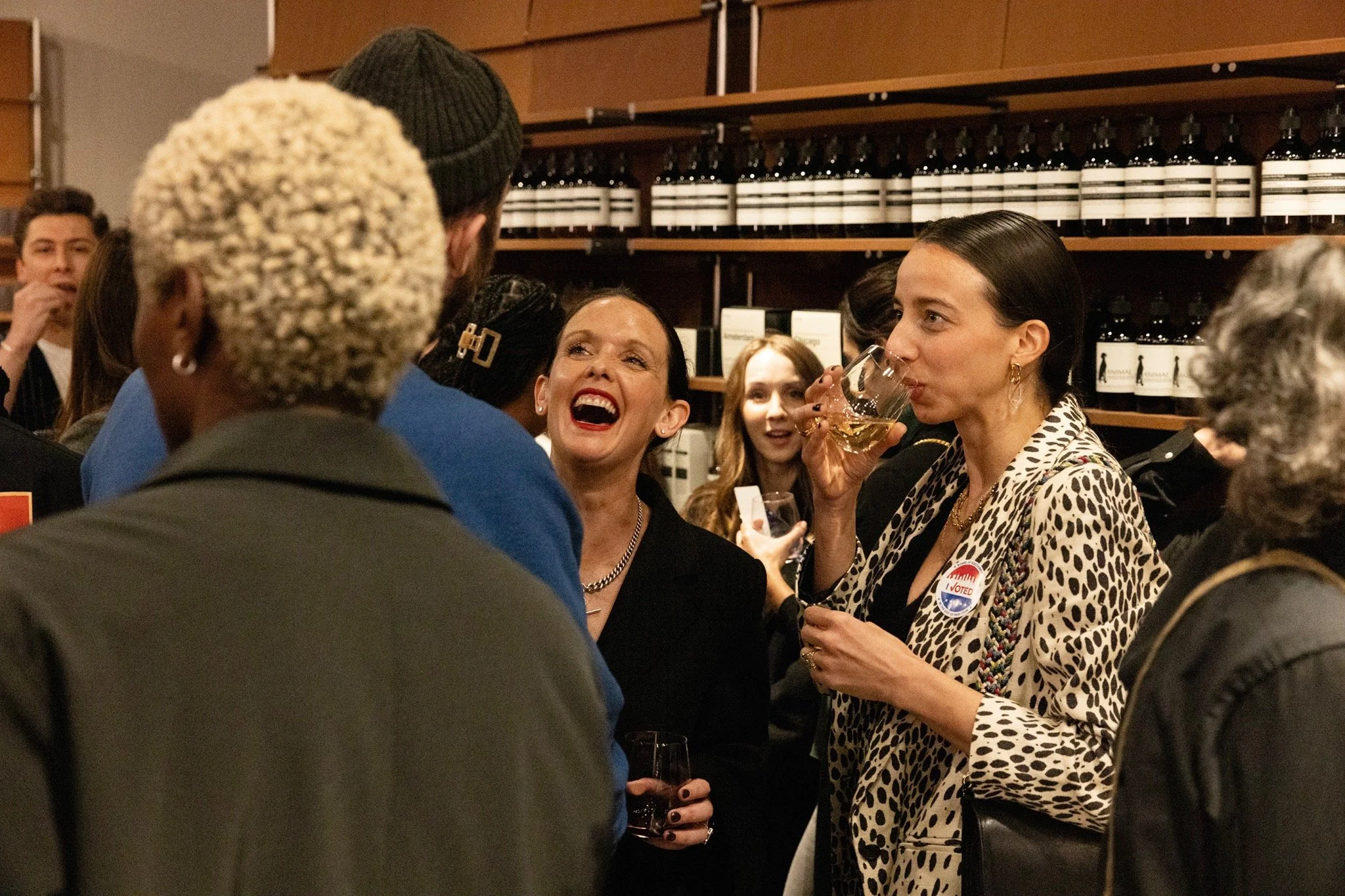Guests sharing a lively conversation during the Aesop and Wallpaper* event in New York.
