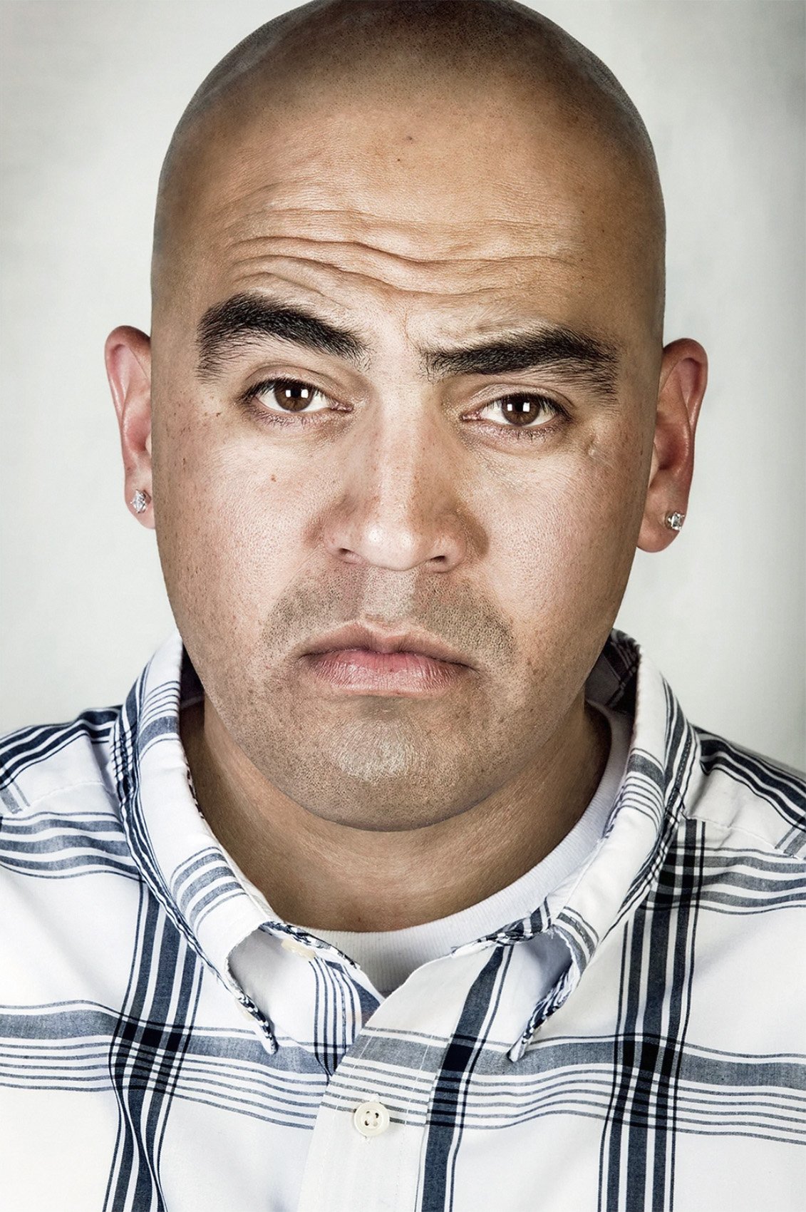 Portrait of David Pina with his tattoos digitally removed.