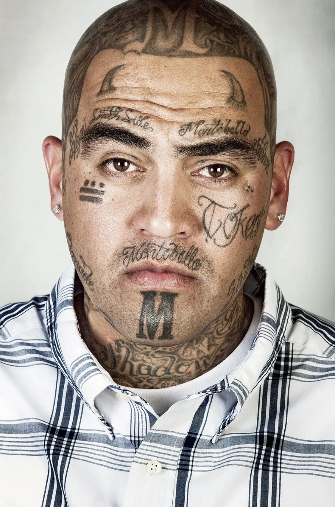 Portrait of David Pina with visible tattoos.