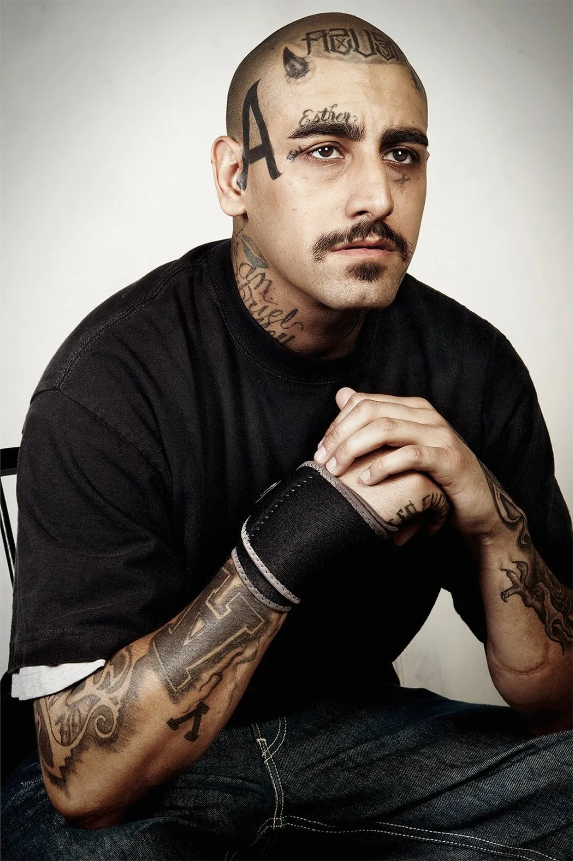Portrait of David Williams with visible tattoos.