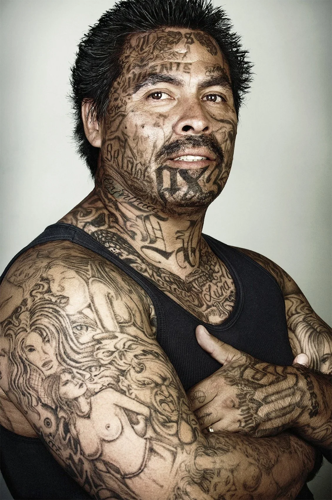Side-by-side Skin Deep portraits of Marcos Luna with and without his tattoos.