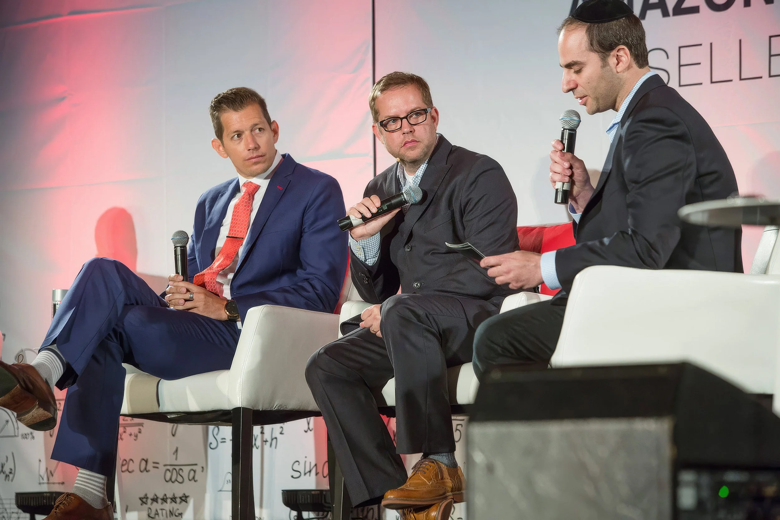 Three speakers taking part in a panel discussion at Feedvisor’s Amazon Professional Sellers’ Summit.