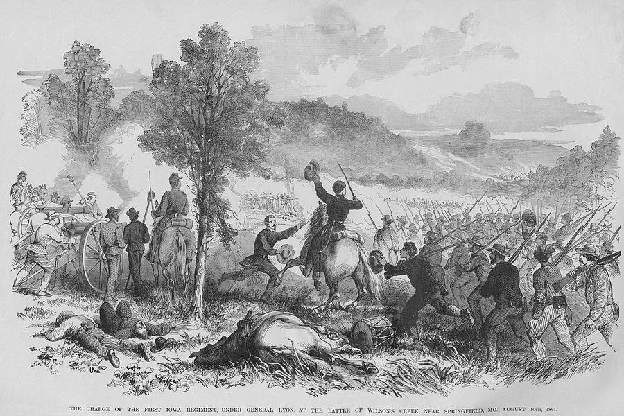 Black and white illustration of a Civil War battle scene with soldiers fighting, horses, and fallen soldiers in the foreground, and smoke and a landscape in the background.