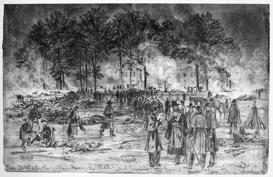 An American Civil War  battlefield with soldiers, some laying on the ground, smoke and fire in the background, and trees and buildings.