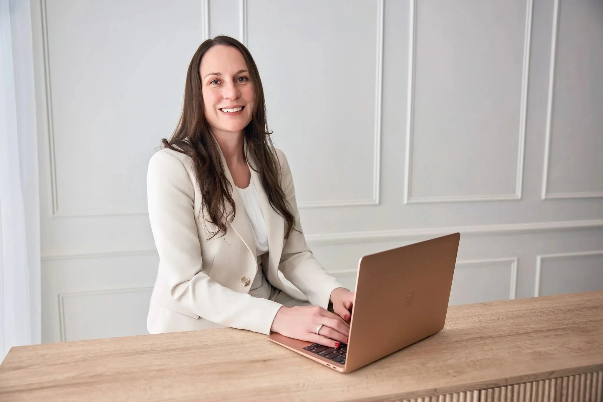 Psychiatric mental health nurse practitioner smiling while doing telehealth.