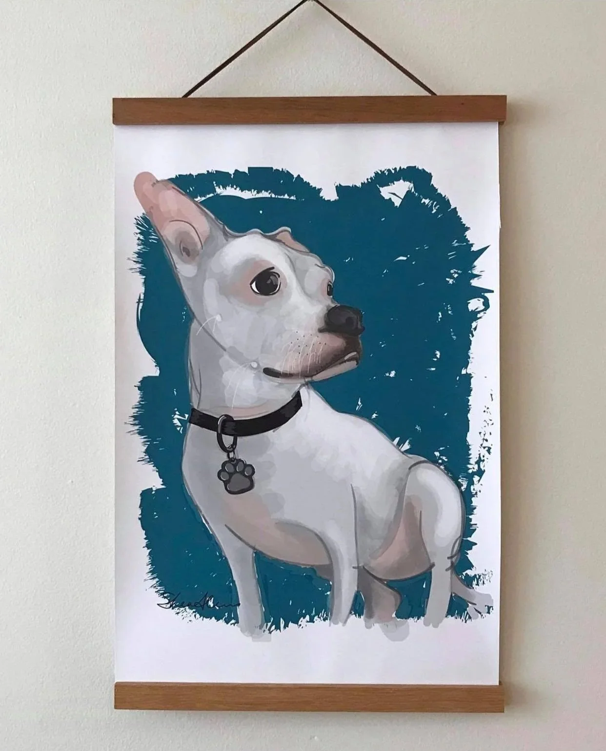 Printed version of a digital portrait for a white short-haired dog with a collar with a paw pendant, set against a blue background.