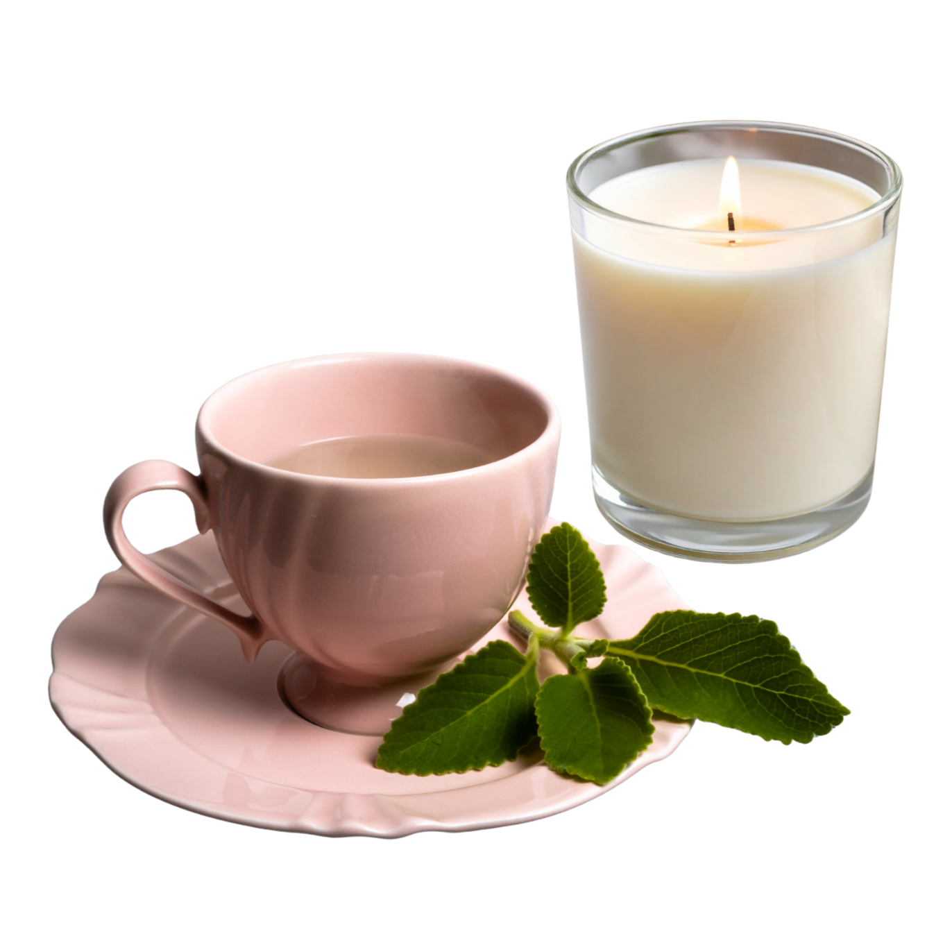 A pink teacup filled with tea on a pink scalloped saucer, with green leaves nearby, alongside a lit white candle in a clear glass holder.