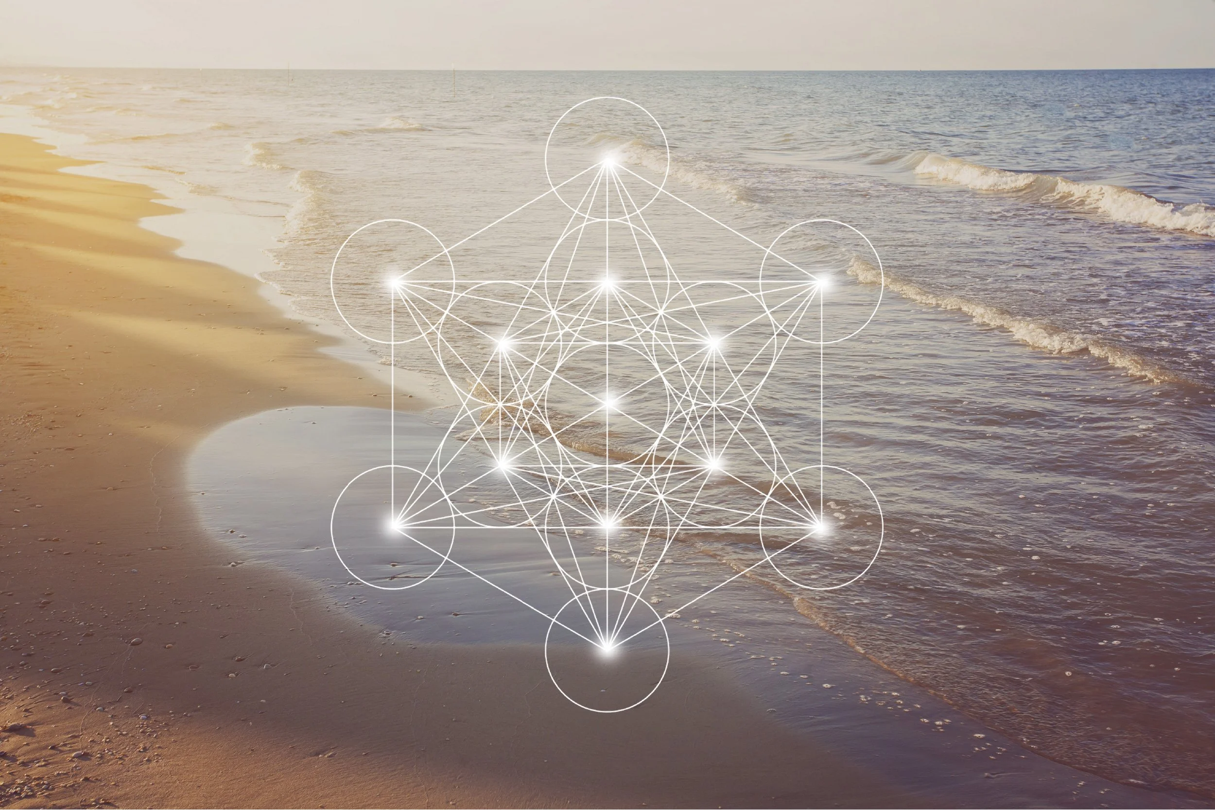 A sandy beach with waves gently lapping at the shore under a clear sky, overlaid with a metatron cube.