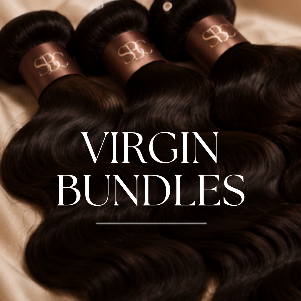 Bundles of dark, wavy virgin hair extensions with pink bands that have a white monogram logo, displayed on a cream-colored surface.