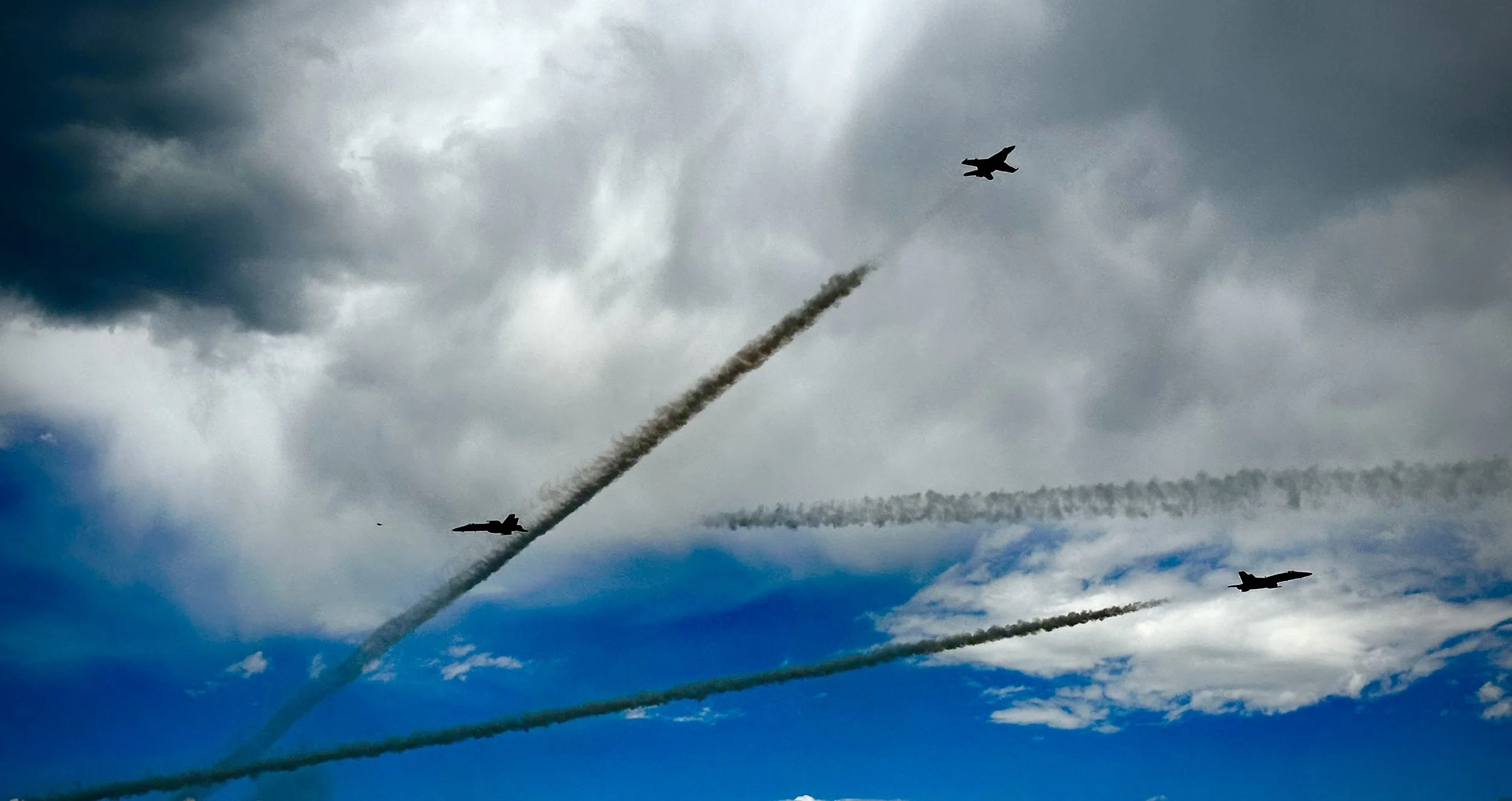 Aircraft in flight against a dramatic sky