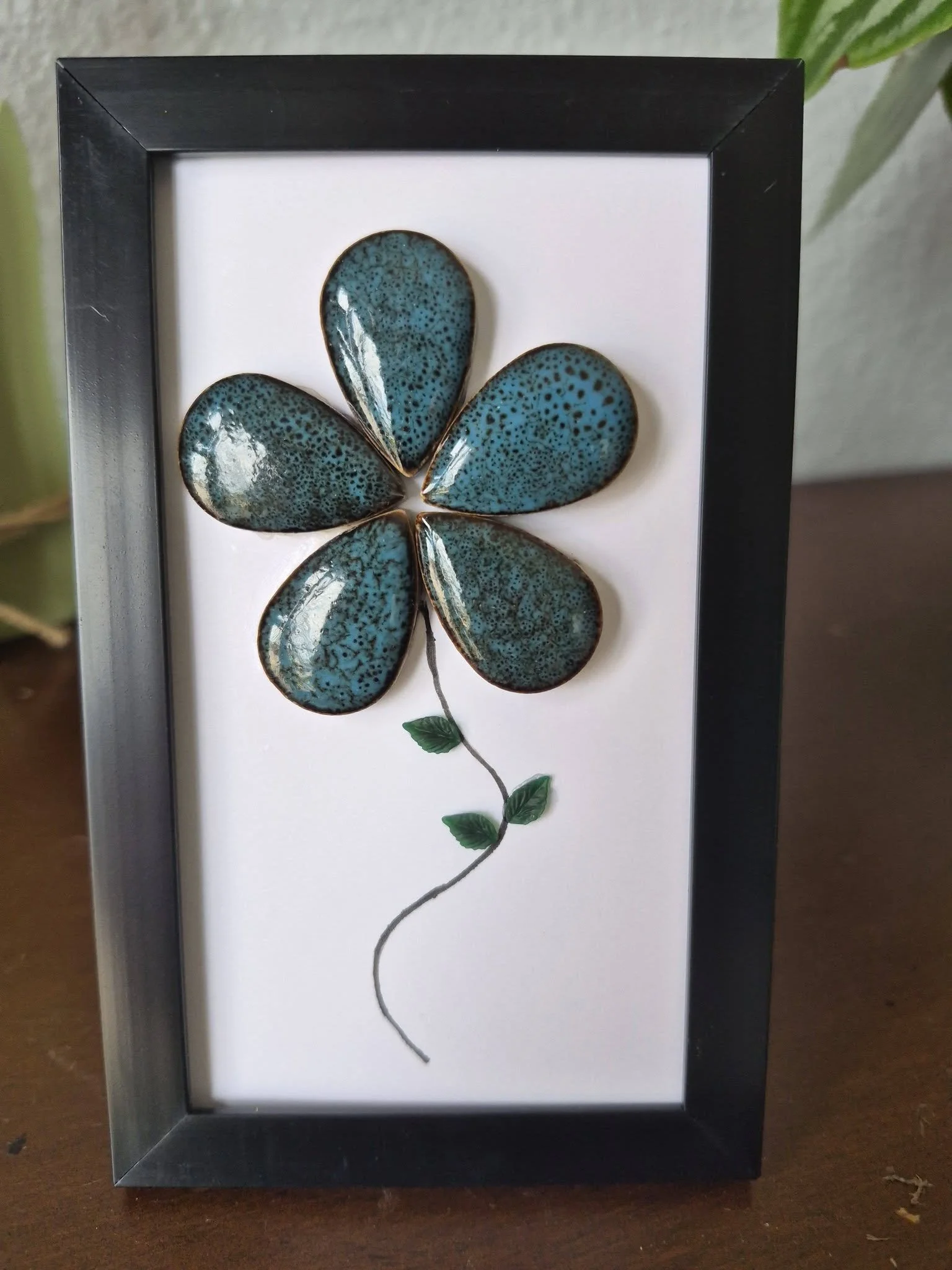 Handmade seaglass flower art in black frame