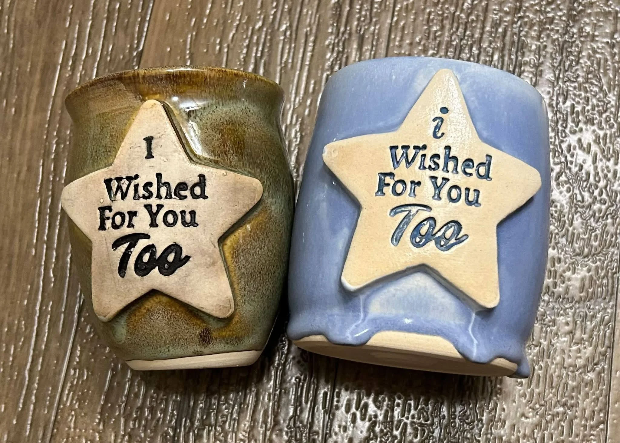 Handmade ceramic cups with star plaques reading “I Wished For You Too,” crafted by Purple Moon.
