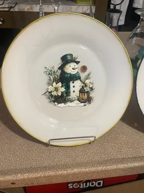 Hand‑painted snowman decorative plate with winter florals by This and That Crafts.