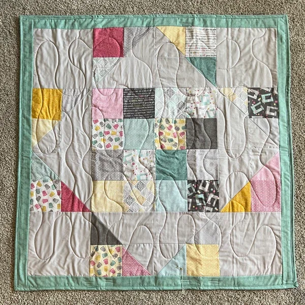 Handmade colorful patchwork quilt with mixed geometric fabric blocks