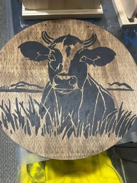 Rustic cow woodburn‑style plaque handcrafted by This and That Crafts in Gilbertville.