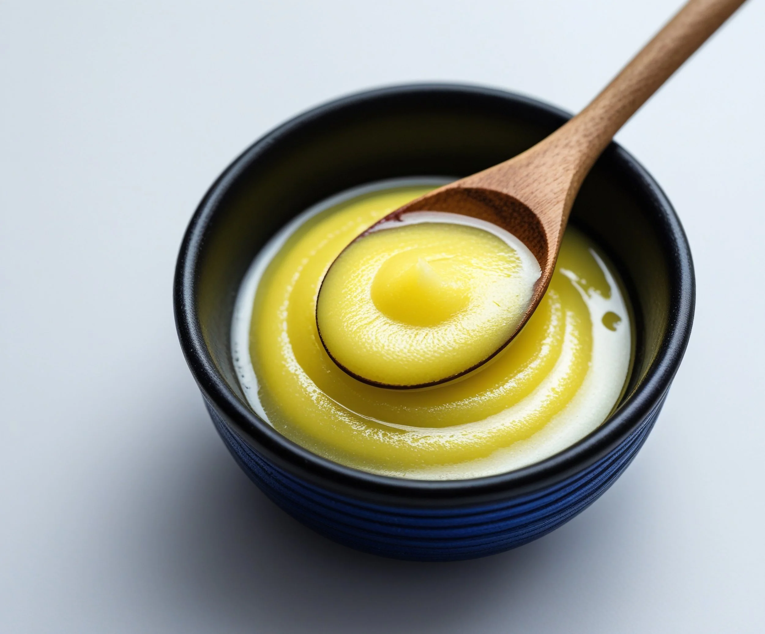 vecteezy_ghee-on-a-bowl_77866798.jpg