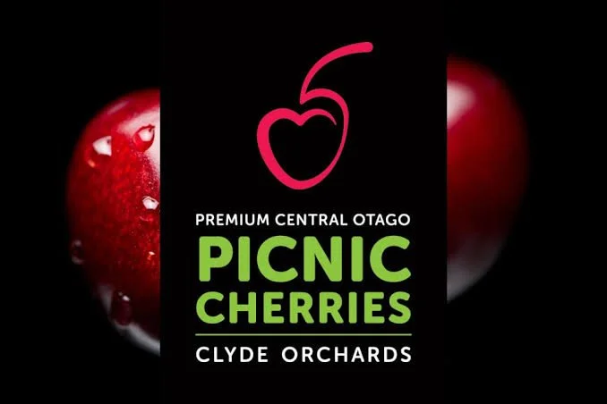 Logo for Picnic Cherries from Clyde Orchards, featuring a stylized cherry and text describing the cherries as premium central Otago cherries.