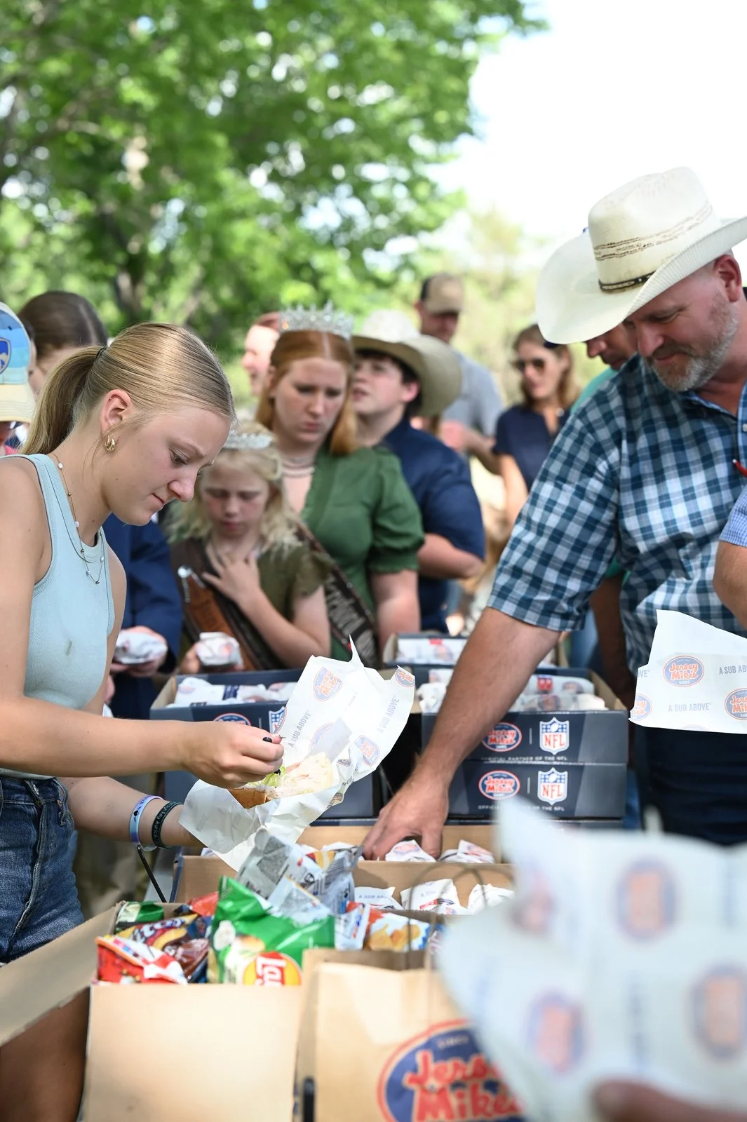 Families enjoy dinner from Jersey Mikes at the opening ceremonies of the Miniature Hereford Junior Nationals.  Dinner for the families was sponsored by the Miniature Hereford Breeders Association