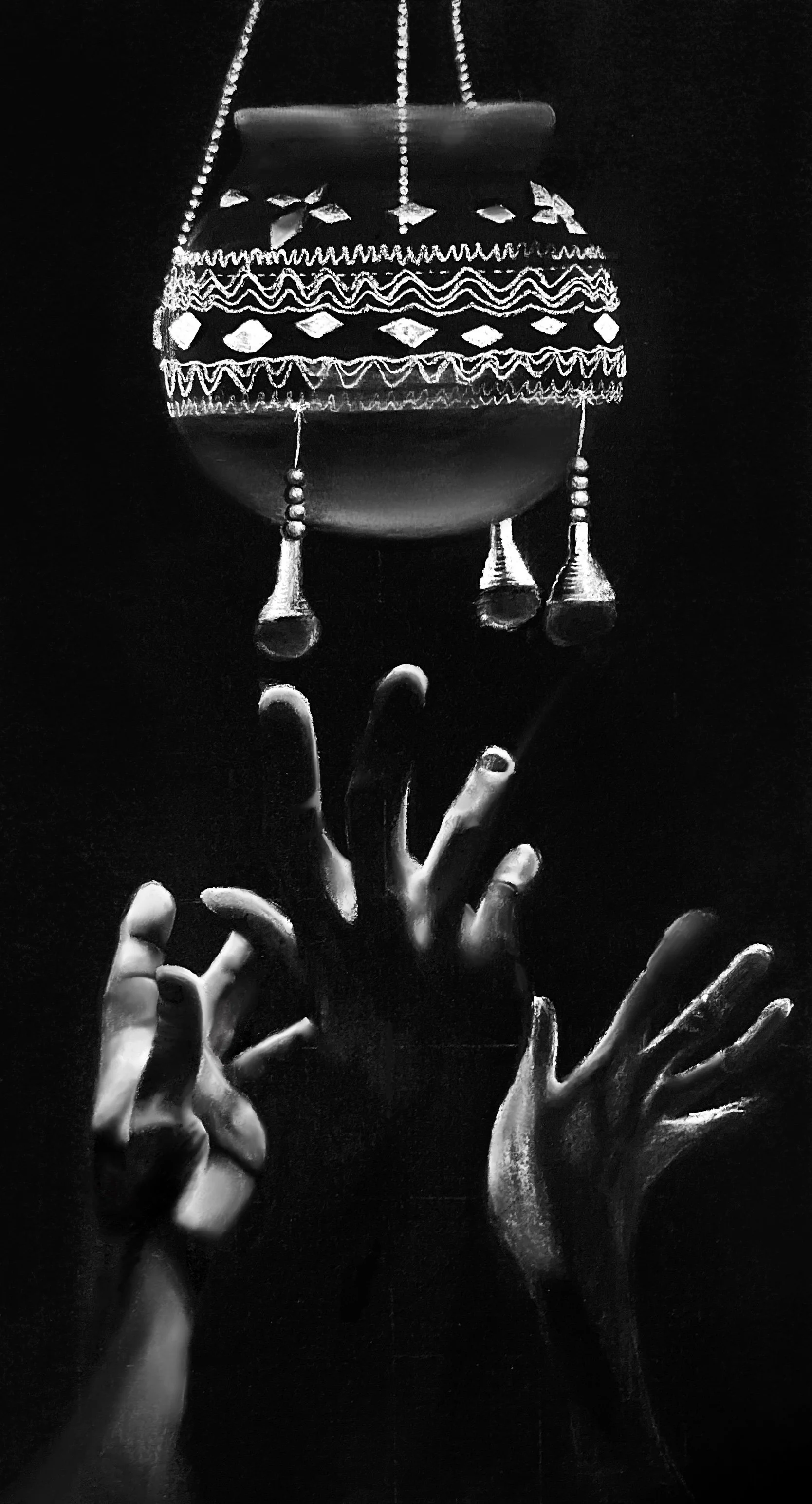 Black and white photo of multiple hands reaching towards a hanging decorative object with beads and fringes, held by strings.
