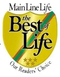 Book cover titled 'The Best of Life' by Main Line Life, with a yellow apple graphic, green and orange stripes, and five stars at the bottom. Tagline: 'Our Readers' Choice'.