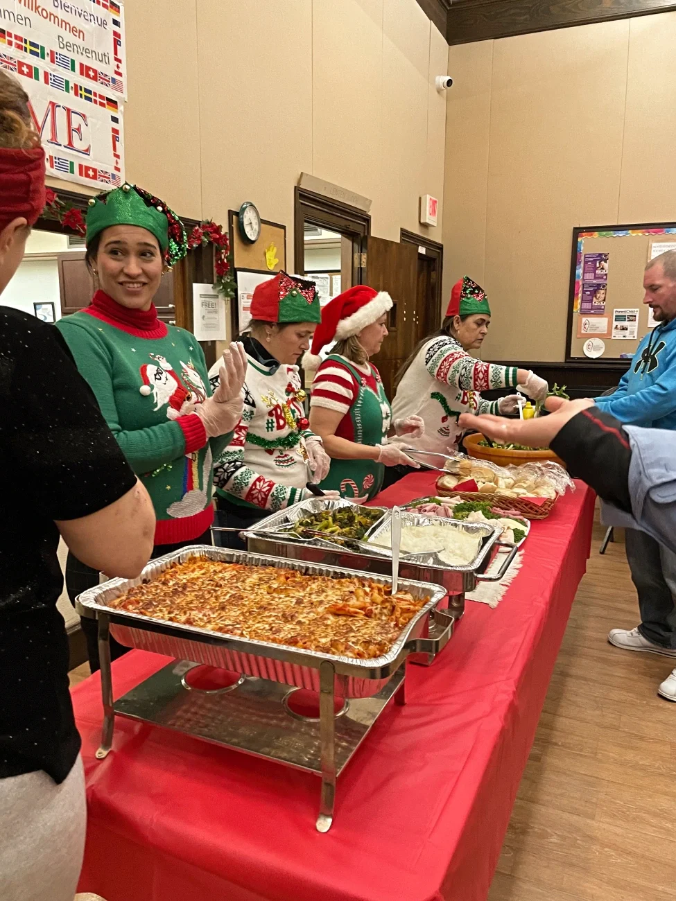 four female volunteers serving food