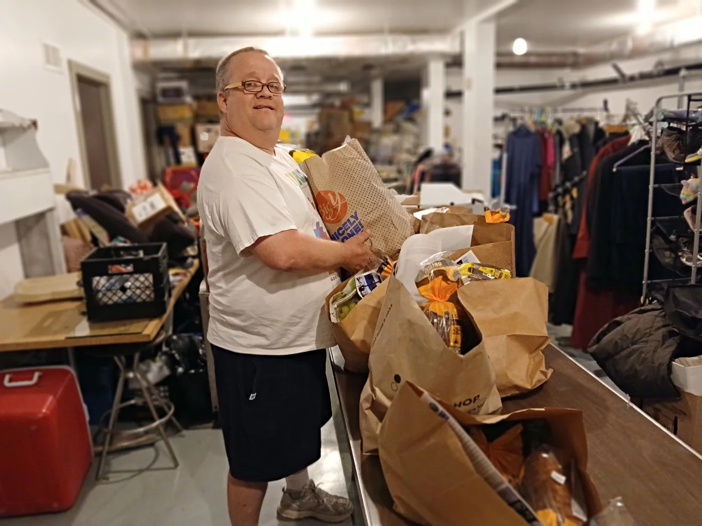 A man holding a bag of food
