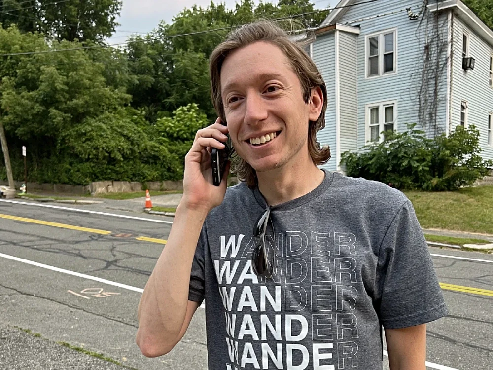 A man standing on the street on his cell phone